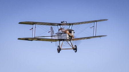Photo for Old Warden, UK - 2nd October 2022: Vintage aircraft Royal Aircraft Factory S.E.5 in flight, low and heading towards camera - Royalty Free Image