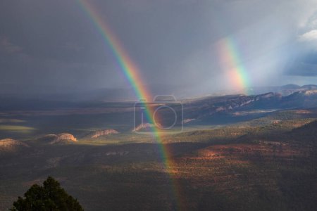 A rainbow appears near the Grand Canyon after a monsoon passes through Northern Arizona