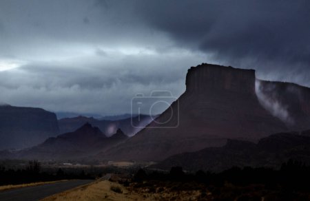 A passing rainstorm brings some clouds, fog and  dramatic looks to the landscape at Castle Valley, Utah