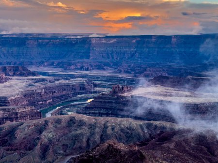 A passing rainstorm brings some clouds, fog and  dramatic looks to the landscape at Dead Horse Point State Park, Utah