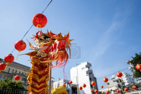 Photo for Dragon and lion dance show in chinese new year festival (Tet festival ), lion Dance - dragon and lion dance street performances in Vietnam. Holidays and celebrations concept. Selective focus. - Royalty Free Image