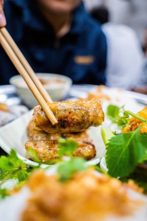 Photo for Banh cuon - Vietnamese steamed rice rolls with minced meat inside accompanied by bowl of fish sauce. Detail. Selective focus. - Royalty Free Image