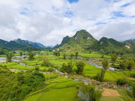 Photo for Aerial landscape in Quay Son river, Trung Khanh, Cao Bang, Vietnam with nature, green rice fields and rustic indigenous houses. Travel and landscape concept. - Royalty Free Image