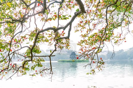 Hoan Kiem Lake ( Ho Guom) or Sword lake in the center of Hanoi in the fog in the morning. Hoan Kiem Lake is a famous tourist place in Hanoi. Travel and landscape concept. Selective focus.