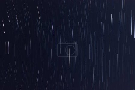 Photo for Star trails in dark starry night sky - Royalty Free Image