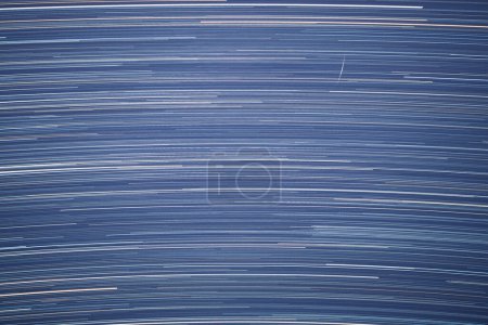 Photo for Star trails in dark starry night sky - Royalty Free Image