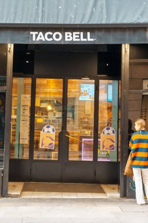 Photo for Barcelona, Spain-December 6, 2022. Logo and facade of Taco Bell Tex-Mex fast food restaurant chain. Originated in Irvine, California in 1962 by Glen Bell. Subsidiary of Yum Brands - Royalty Free Image