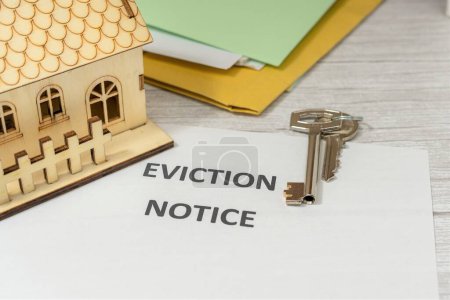 Photo for Notification of seizure of a house. Handing over the keys to the house. Lack of payment to financial institution. Real estate crisis. Court documents - Royalty Free Image