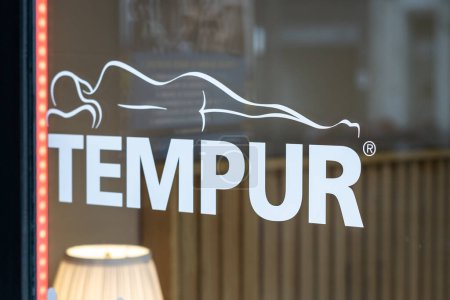 Barcelona, Spain-April 2, 2023. Tempur, now part of Tempur Sealy International, is a manufacturer and distributor of mattresses and pillows made of viscoelastic foam. Logo on the front door
