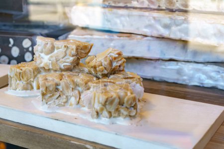 Photo for Turron duro or hard almomd nougat. It traditional sweet consumed in Spain at Christmas time - Royalty Free Image
