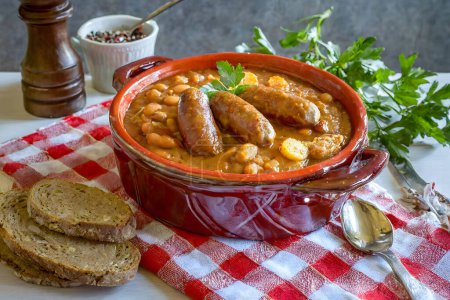 French Cassoulet. Hearty French sausage and bean stew with a crispy breadcrumb topping.