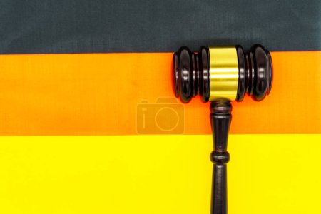 Legal authority in Germany represented by a gavel on the German flag.