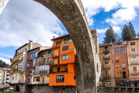 Photo for Girona, Spain - March 29, 2024. The river Ter passes through the medieval village of Camprodon with its ancient stone bridge. Girona, Spain - Royalty Free Image