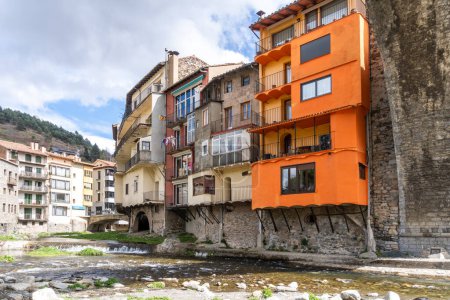 Girona, Spain - March 29, 2024. The river Ter passes through the medieval village of Camprodon with its ancient stone bridge. Girona, Spain