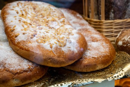 Coca de sant joan. Traditional San Juan cake to celebrate the arrival of summer in Spain made with brioche bread, candied fruit and nuts.