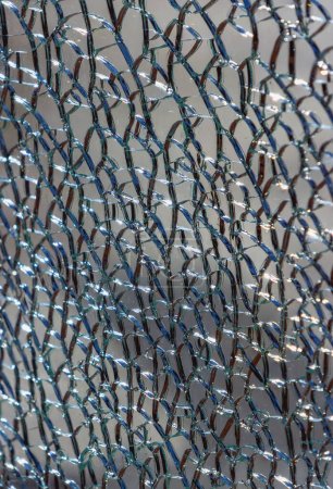Photo for Abstract background of broken tempered glass of different shapes and lines close up - Royalty Free Image