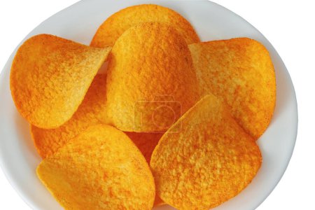 Top view of round crispy potato chips with paprika on a plate on a white background