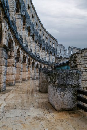 Photo for Dramatic sky frames the circular pahtway around the Pula Arena or amphitheater in Croatia - Royalty Free Image