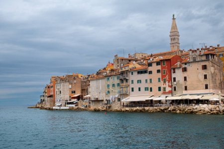 Photo for Tower of the church of saint euphemia rises above the ancient buildings of Rovinj - Royalty Free Image