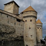 Ancient turrets of the Chillon Castle contreast against the stormy skies