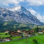 The Bernese Alps tower over the quaint town of Grindelwald Switzerland