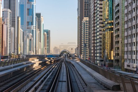 Photo for Dubai Metro rail way Station and modern glass buildings - Royalty Free Image