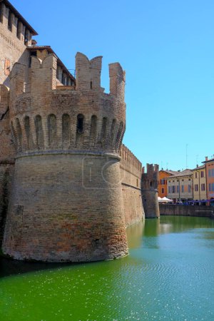 Photo for Fontanellato, Parma: tower of the castle La Rocca Sanvitale, its bridge over the lake on a sunny day - Royalty Free Image