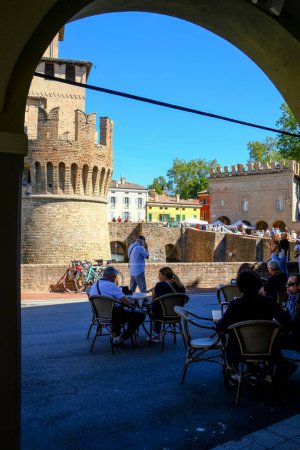 Photo for September 2022 Fontanellato, Parma: People at the open-air bar across the castle La Rocca Sanvitale on a sunny day - Royalty Free Image