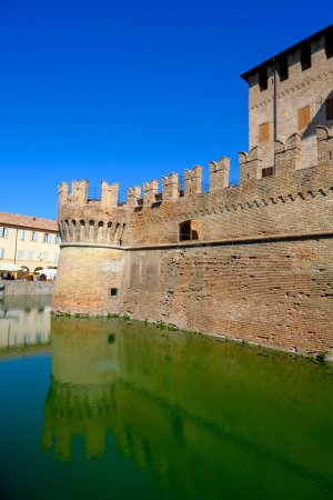 Photo for Fontanellato, Parma: the building of the castle La Rocca Sanvitale across the lake on a market day - Royalty Free Image