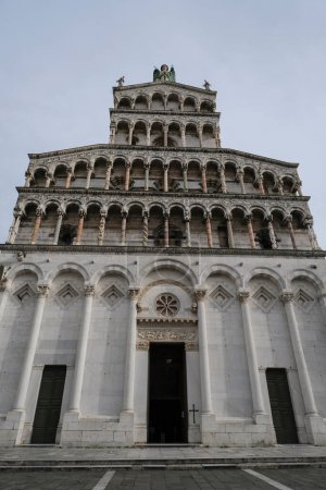 Marble facade of the Basilica church San Michele in Foro  from beneath in Lucca, Tuscany, Italy 
