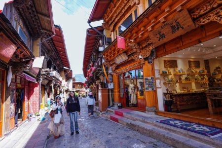 Photo for SHANGRI-LA, CHINA - SEP 5, 2023:Scenic old town street and ancient architecture building at Dukezong old town in Shangri-La, Yunnan, China. - Royalty Free Image