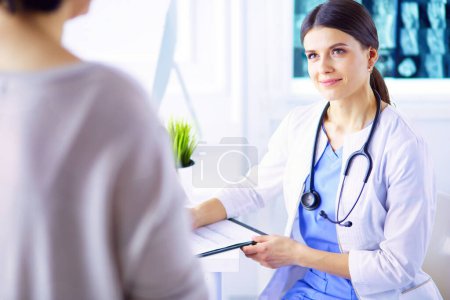 Photo for Medical consultation in a hospital. Doctor listening to a patients problems - Royalty Free Image