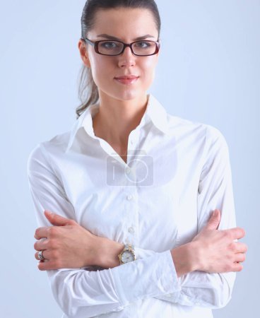 Photo for Attractive businesswoman with her arms crossed standing - Royalty Free Image