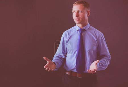 Photo for Portrait of successful businessman. Isolated on dark background. - Royalty Free Image