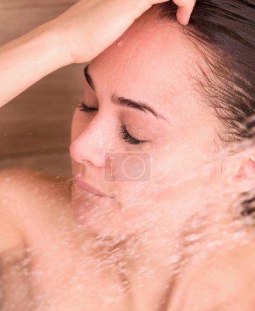 Photo for Young beautyful woman under shower in bathroom - Royalty Free Image