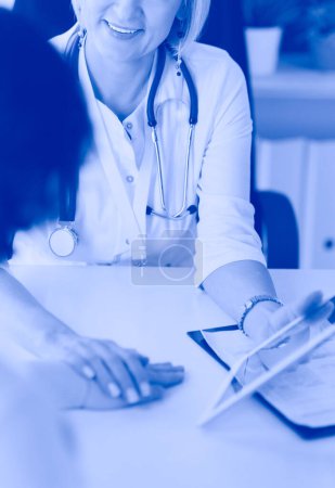 Photo for Doctor explaining diagnosis to her female patient. - Royalty Free Image