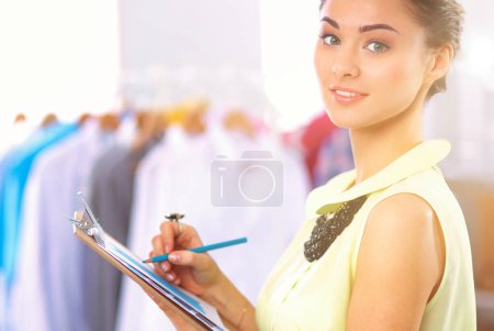 Photo for Modern young fashion designer working at studio.isolated - Royalty Free Image
