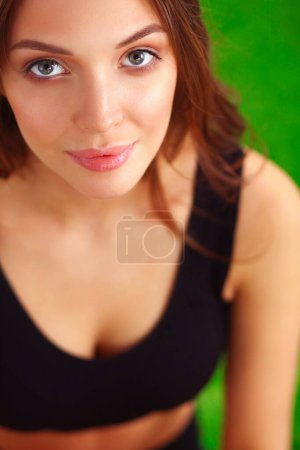 Photo for Woman sitting with crossed legs on the green grass . - Royalty Free Image