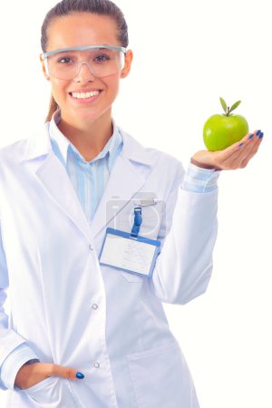 Photo for Smiling woman doctor with a green apple. Woman doctor. - Royalty Free Image