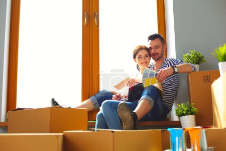 Photo for Portrait of young couple moving in new home. - Royalty Free Image
