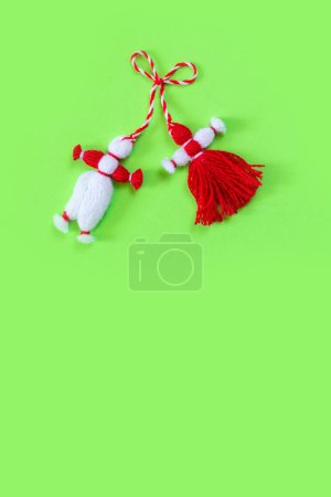 Photo for Bulgarian symbol of spring white and red martenitsa on green background - Royalty Free Image