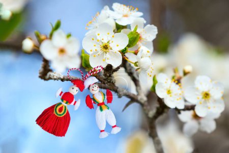 Photo for Bulgarian Martenitsa spring sign on blooming tree branch with flowers, holiday postcard background - Royalty Free Image