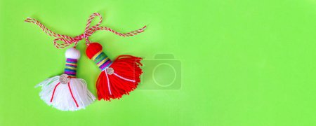 Photo for Bulgarian symbol of spring white and red martenitsa on green banner background - Royalty Free Image