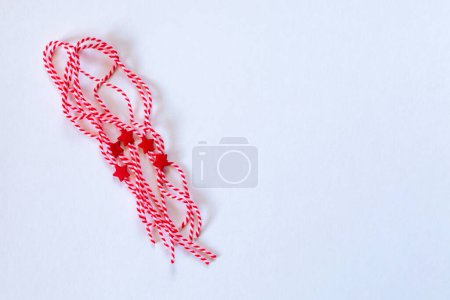 Photo for Bulgarian symbols of spring, many white and red martenitsa on white background - Royalty Free Image