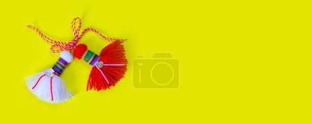 Photo for Bulgarian symbol of spring white and red martenitsa on yellow banner background - Royalty Free Image