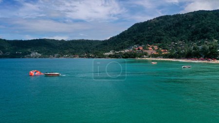 Photo for View from above of clear sea water with boats and parasailing stuff. - Royalty Free Image