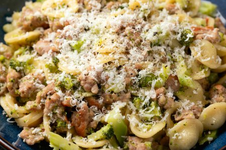 Photo for Broccoli Bolognese with Orecchiette pasta, sausage meat and parmesan cheese. - Royalty Free Image