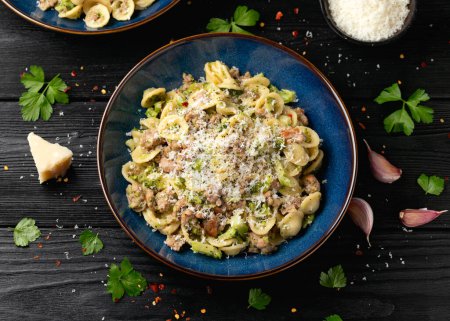 Photo for Broccoli Bolognese with Orecchiette pasta, sausage meat and parmesan cheese. - Royalty Free Image