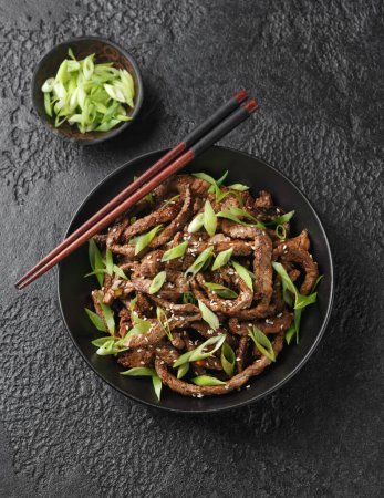 Photo for Korean beef Bulgogi BBQ with sesame seeds and spring onion - Royalty Free Image