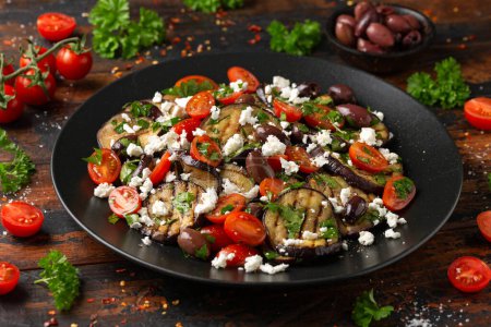 Photo for Roasted Eggplant, Tomato salad with kalamata olives and Feta cheese. - Royalty Free Image